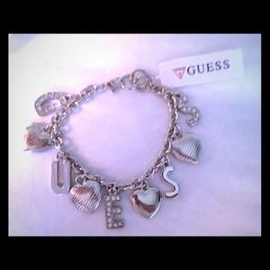 GUESS -Have some fun with this flirty bracelet .