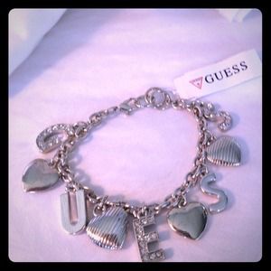 GUESS -Have some fun with this flirty bracelet .
