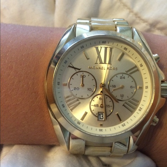 Gold toned Micheal Kors watch.