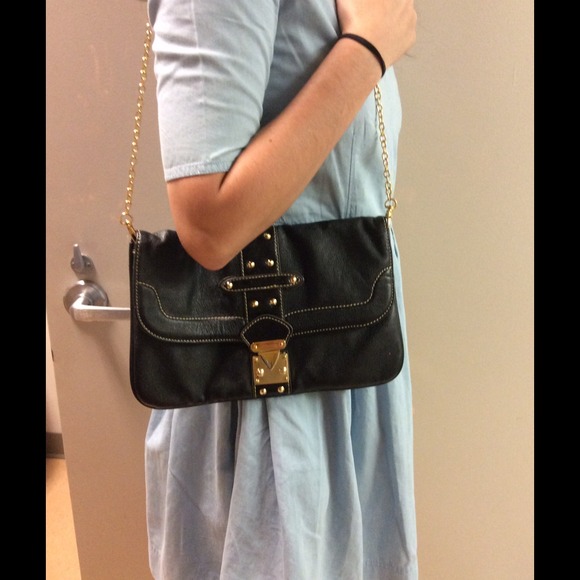 Black handbag with gold chain