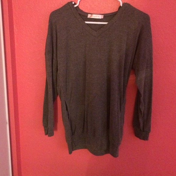 Grey long sleeve hooded top.