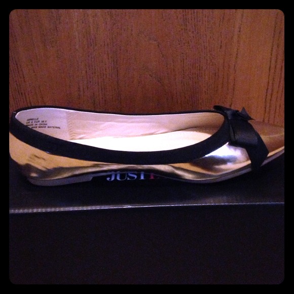 Brand New Gold Ballet Flats with Black Bow.