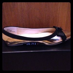 Brand New Gold Ballet Flats with Black Bow.