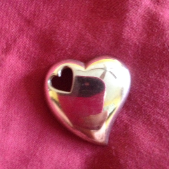 Silver heart within a heart pendant