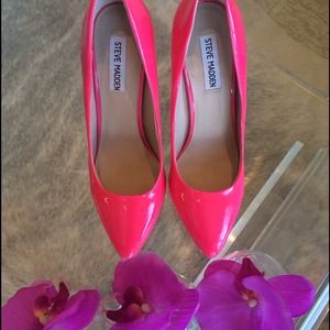 Hot pink patent pumps