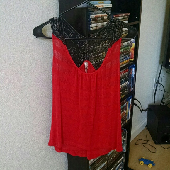 Red tank with a black butterfly back.