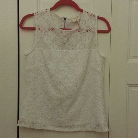 I am selling a white floral tank.