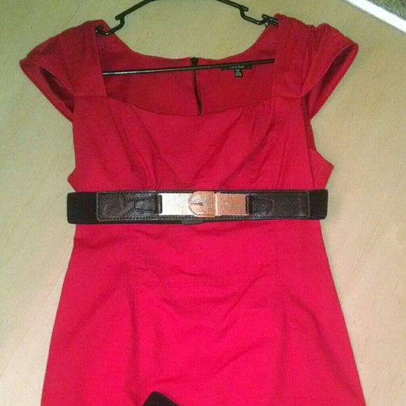 Firm fitting slick red dress.