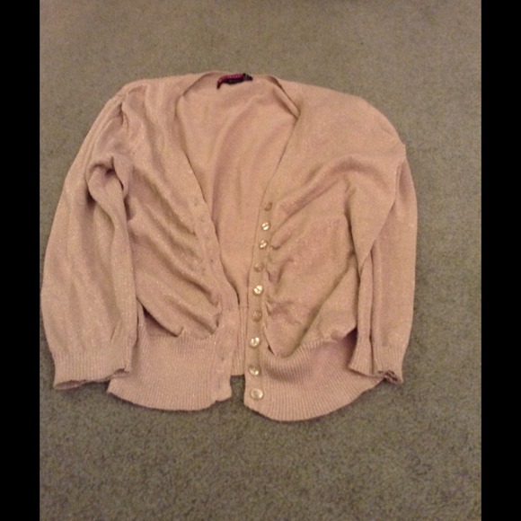 Say what large gold sweater