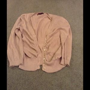 Say what large gold sweater