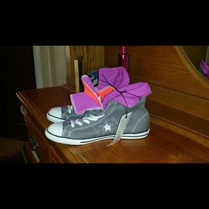 New with tags. Converse hightops. Size 8.