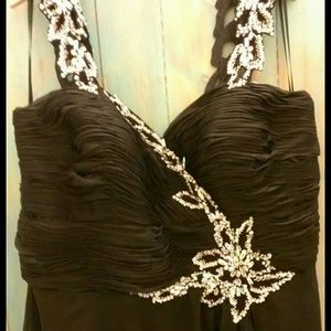 Black dress with slip down the left side leg.