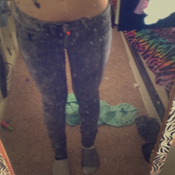 Grey acid washes skinny jeans.