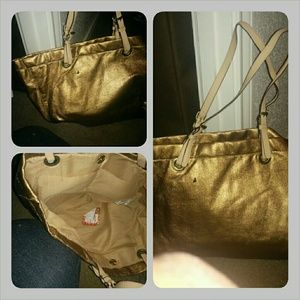 Gold arm bag