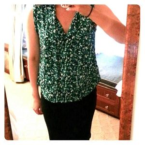 Printed green sleeveless blouse