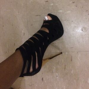 Black strapped gold healed high hell shoes
