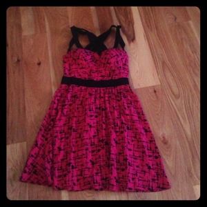 Pink background with black splash paint print