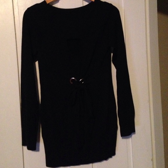 Black sweater with keyhole neck and grommet detail