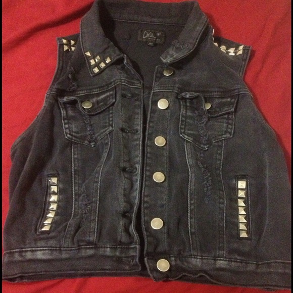 Distressed faded black denim vest with studs