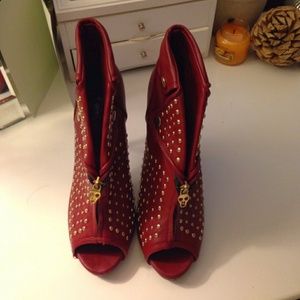 Red studded heels never worn