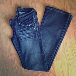 Faded black boot cut studded jeans