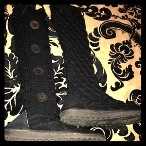 Black sweater boots with buttons