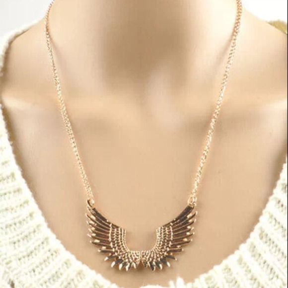 Gold tone wings
