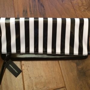 Fun Banana Rep black & white striped clutch.