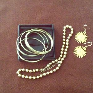 Set of 6 gold colored bangle bracelets