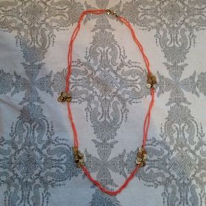Long pink necklace with gold disks