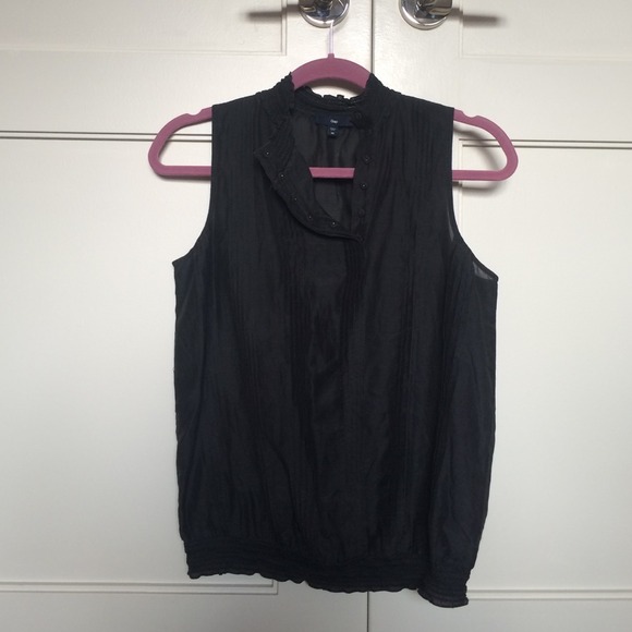Sheer black blouse with small detail