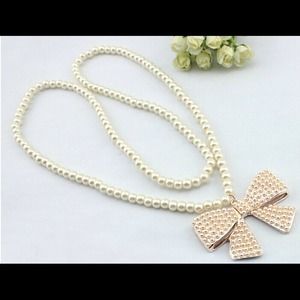 Pearl bow long necklace