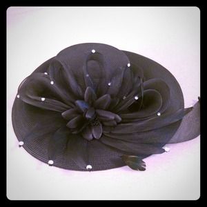 Large black derby hat with flower
