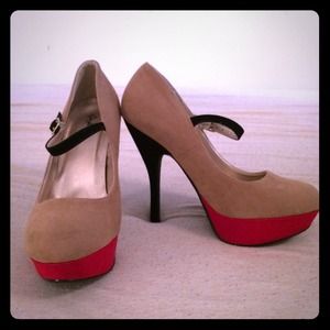 Nude, black, and red suede pumps