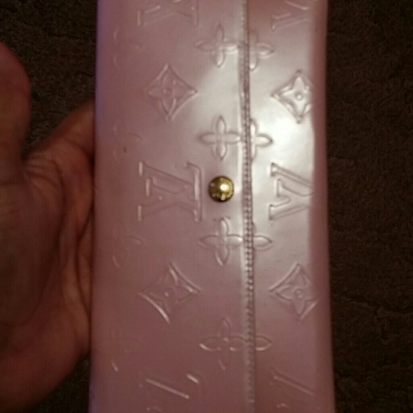 Pink wallet and small white bag
