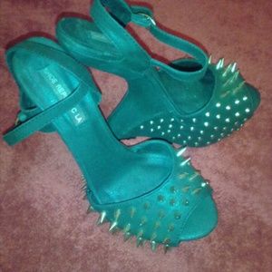 Used heeless black shoes with brass spikes/studs