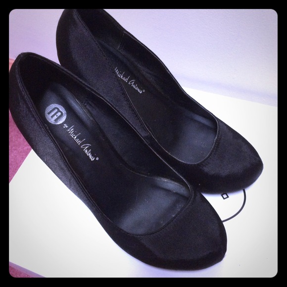 Black satin pumps