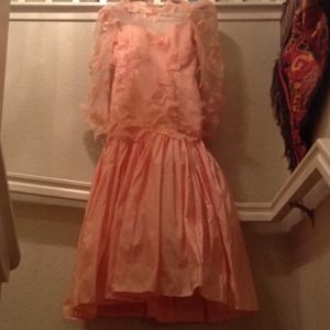 A peach dress with a floral design.