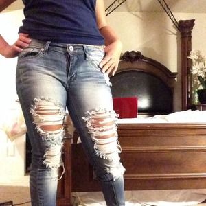 Jeans ripped in the front for style