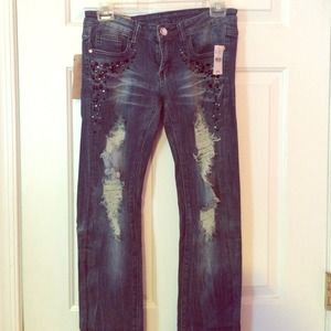 lightly destroyed studded jeans