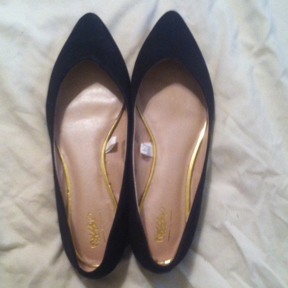 Pointed black suede flats