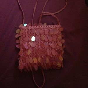 Pink over the shoulder bag.