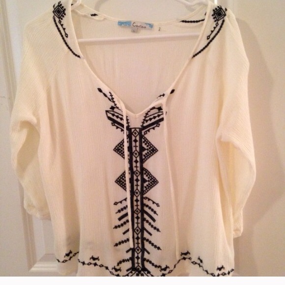 Cream and black top