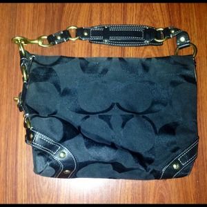 Black on black signature Coach Carly