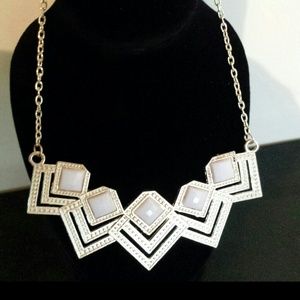 Gold necklace with white stones