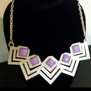 Gold necklace with purple stones