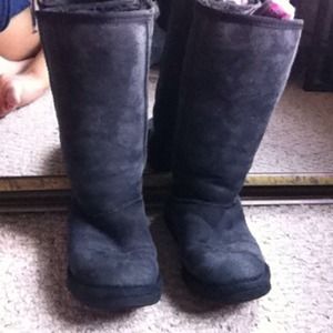 Tall black UGG style boots