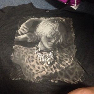 A long sleeve shirt that is missing some jewels