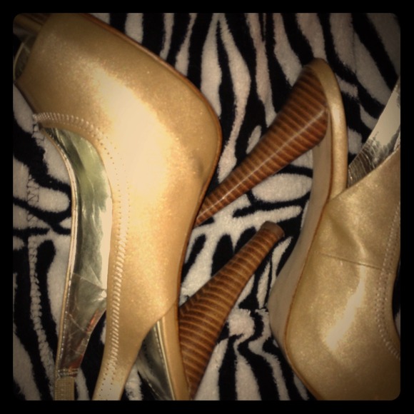 Gold four inch heels