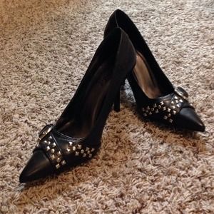 Black, pointy-toed belted heels